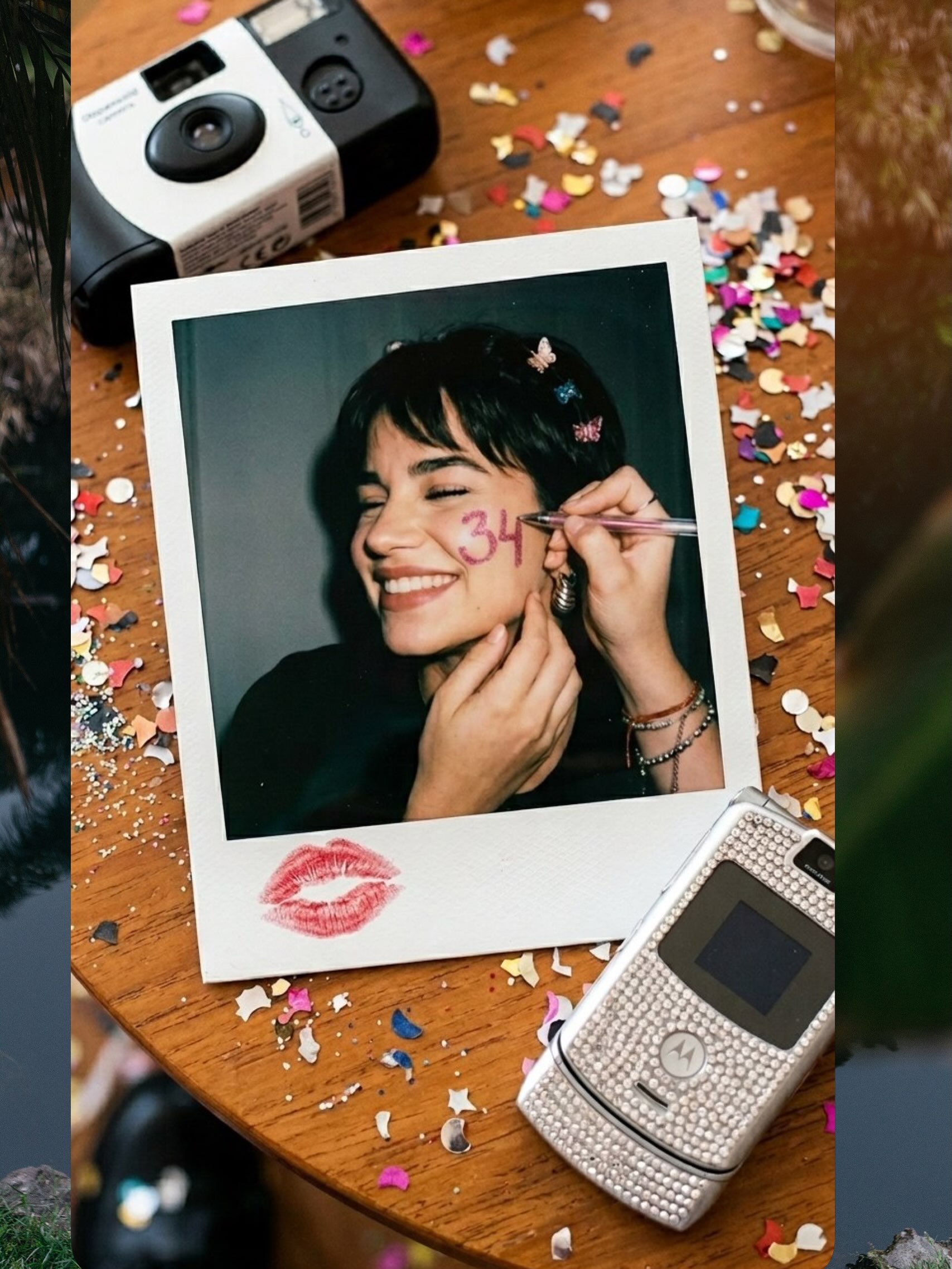 A Polaroid birthday portrait of Veronika Erler surrounded by confetti