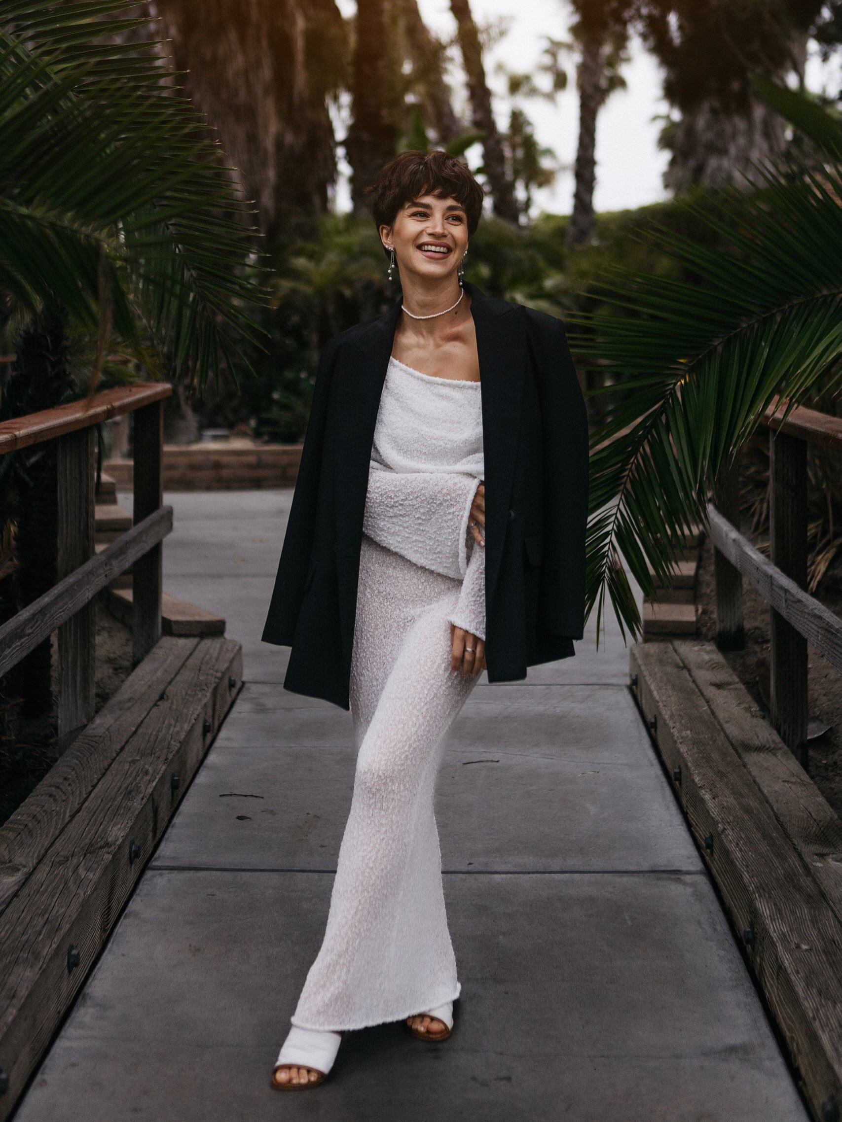 Veronika Erler in a white dress and black blazer in San Diego