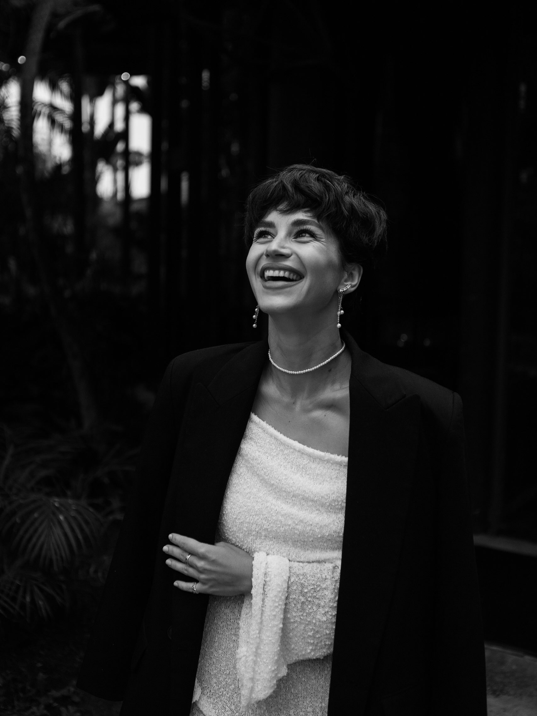 Black-and-white portrait of Veronika Erler smiling and looking upwards